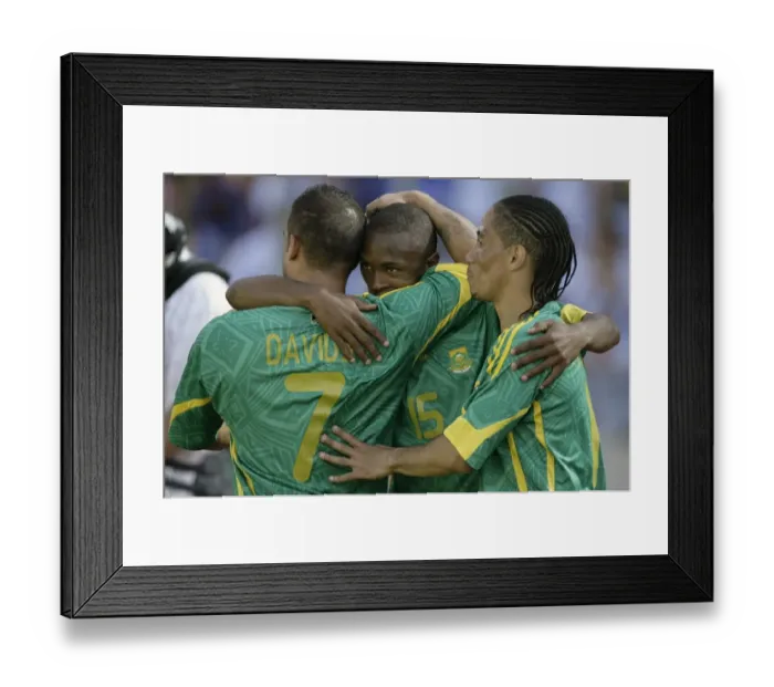 Framed Print : South Africas Parker celebrates with teammates Davids and Pienaar after scoring against Norway during Nelson Mandela soccer challenge in Rusternburg