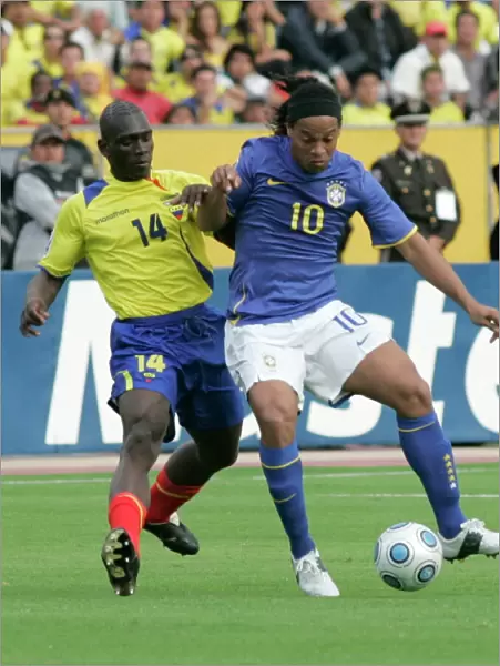 Ecuadors Castillo fights for the ball Brazils Ronaldinho during their World Cup qualifier soccer match in Quito