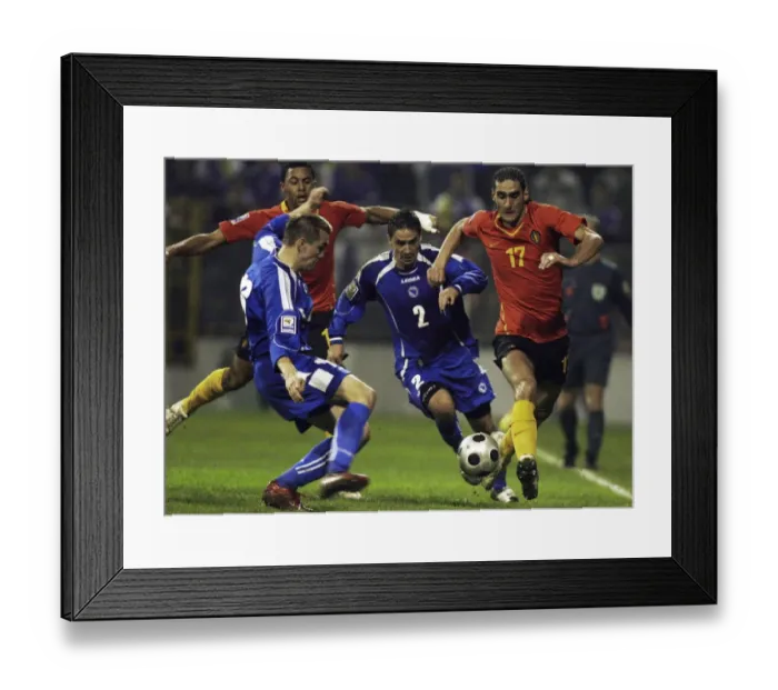 Framed Print : Marouane Fellaini-Bakkioui of Belgium is challanged by Bosnias Boris Pandza and Dzemal Berberovic during their 2010 World Cup qualifying soccer match in Zenica