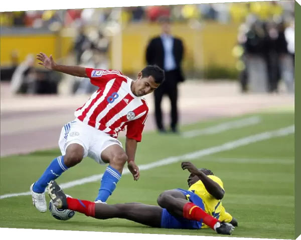 Ecuadors Castillo tackles Paraguays Aquino during their 2010 World Cup qualifying soccer match in Quito