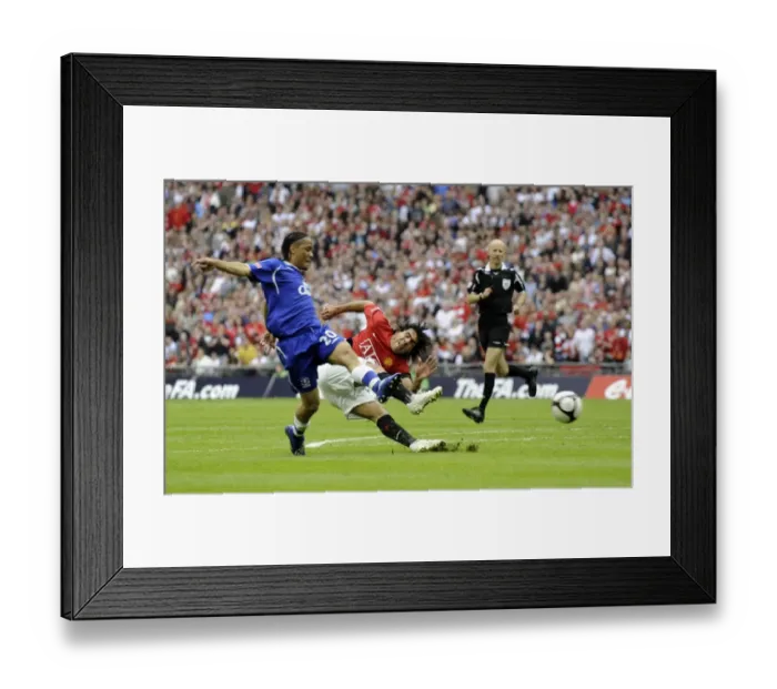 Framed Print : Tevez Threatens: Everton vs Manchester United FA Cup Semi-Final - A Stunning Showdown at Wembley Framed Print : Tevez Threatens: Everton vs Manchester United FA Cup Semi-Final - A Stunning Showdown at Wembley
