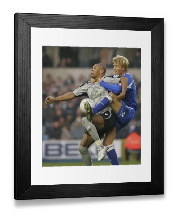 Framed Print : Marcus Bent vs. Zak Whitbread: A Football Rivalry Unfolds