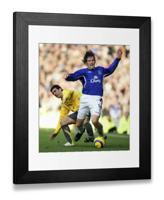 Framed Print : Kevin Kilbane vs Jose Antonio Reyes: A Footballing Battle - Kilbane Fouled by Reyes