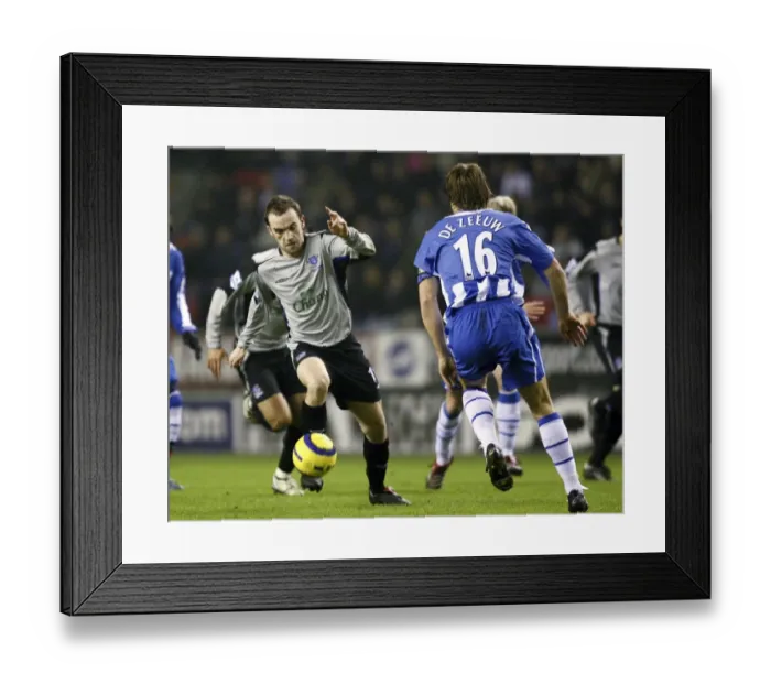 Framed Print : McFadden vs. De Zeeuw: A Football Battle at Everton Framed Print : McFadden vs. De Zeeuw: A Football Battle at Everton