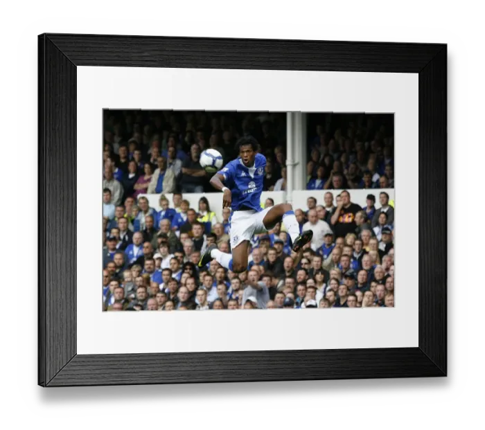 Framed Print : Everton vs Arsenal: Barclays Premier League Battle at Goodison Park - Joao Alves in Action