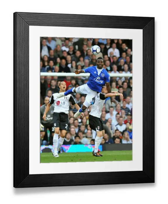Framed Print : Everton's Joseph Yobo vs. Fulham's Andrew Johnson: Aerial Battle in the Premier League Framed Print : Everton's Joseph Yobo vs. Fulham's Andrew Johnson: Aerial Battle in the Premier League