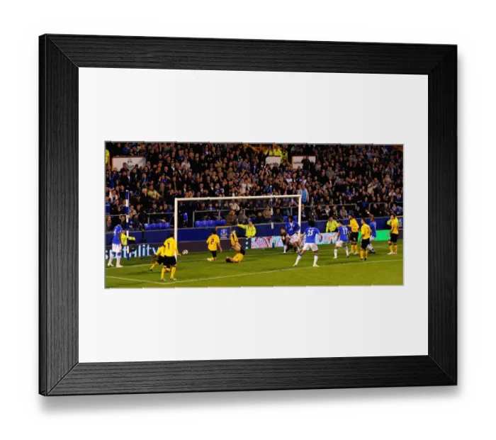 Framed Print : Everton's Europa League Triumph: Sylvain Distin Scores the Decisive Goal Against AEK Athens at Goodison Park Framed Print : Everton's Europa League Triumph: Sylvain Distin Scores the Decisive Goal Against AEK Athens at Goodison Park