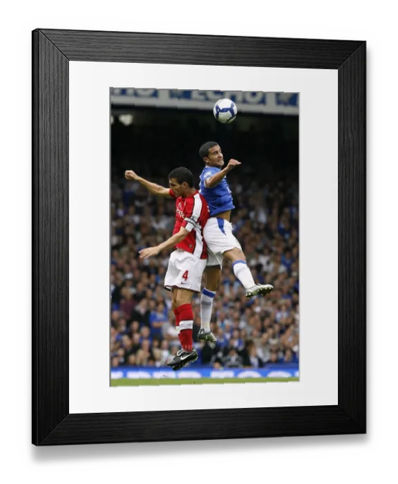Framed Print : Battle for the Ball: Tim Cahill vs. Francesc Fabregas - Everton vs. Arsenal, Premier League