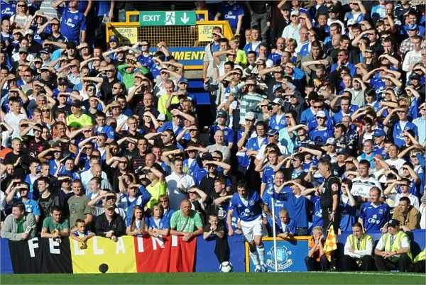 Everton vs Blackburn Rovers: Everton Fans Protect Their Eyes from the Scorching Goodison Park Sun