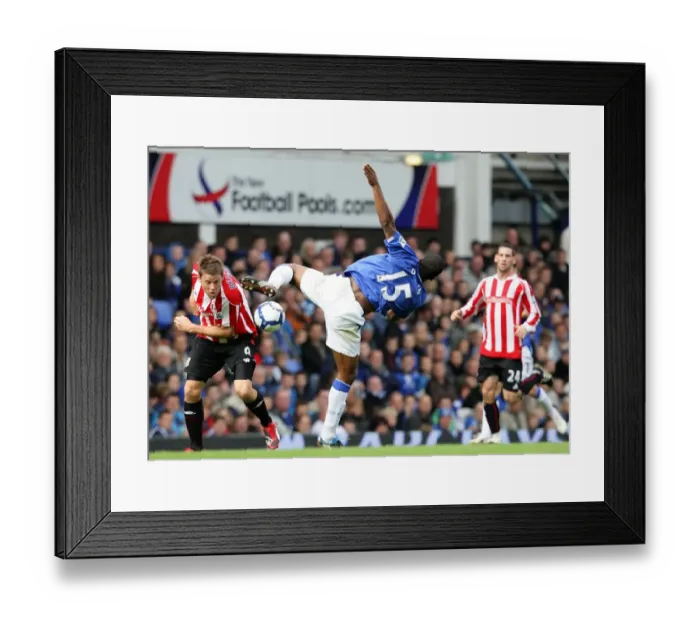 Framed Print : Intense Rivalry: Distin vs Beattie Battle for Ball at Goodison Park - Everton vs Stoke City, Premier League Framed Print : Intense Rivalry: Distin vs Beattie Battle for Ball at Goodison Park - Everton vs Stoke City, Premier League
