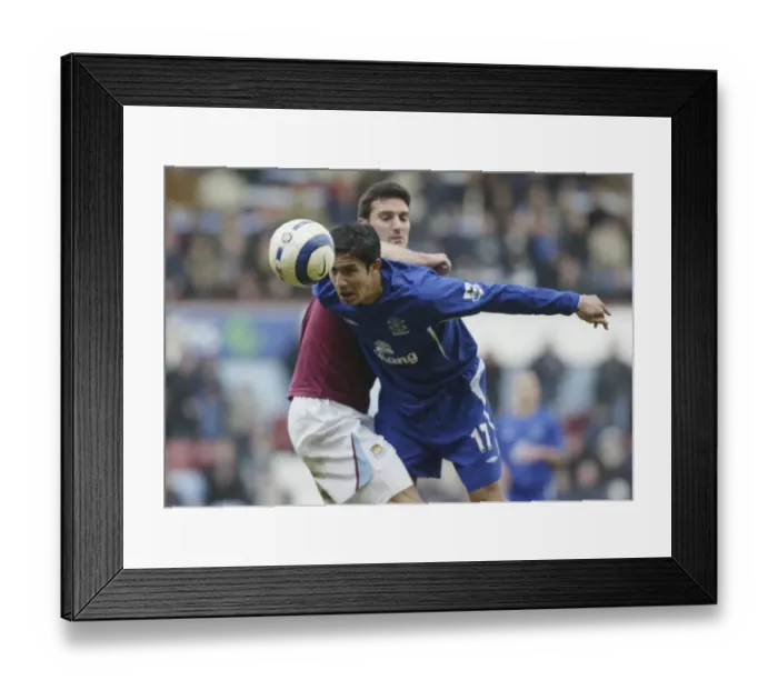 Framed Print : Tim Cahill's Game-Changing Moment: Beating the Defender to the Ball for Everton FC