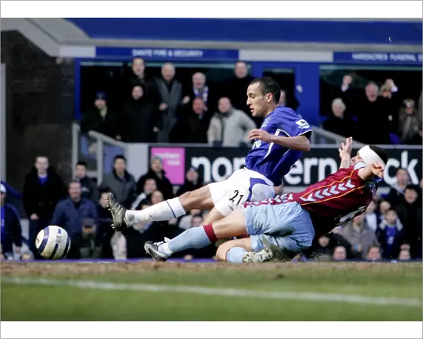 Leon Osman Slides In to Score Everton's Third Goal Against Aston Villa