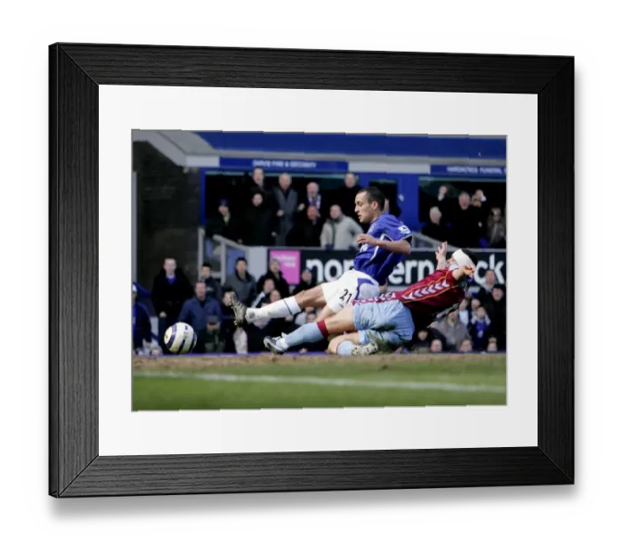 Framed Print : Leon Osman Slides In to Score Everton's Third Goal Against Aston Villa Framed Print : Leon Osman Slides In to Score Everton's Third Goal Against Aston Villa