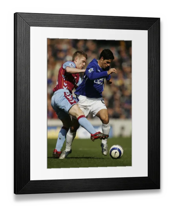 Framed Print : Mikel Arteta Stands Firm: Everton vs Aston Villa - Arteta Holds Off Steven Davis Framed Print : Mikel Arteta Stands Firm: Everton vs Aston Villa - Arteta Holds Off Steven Davis