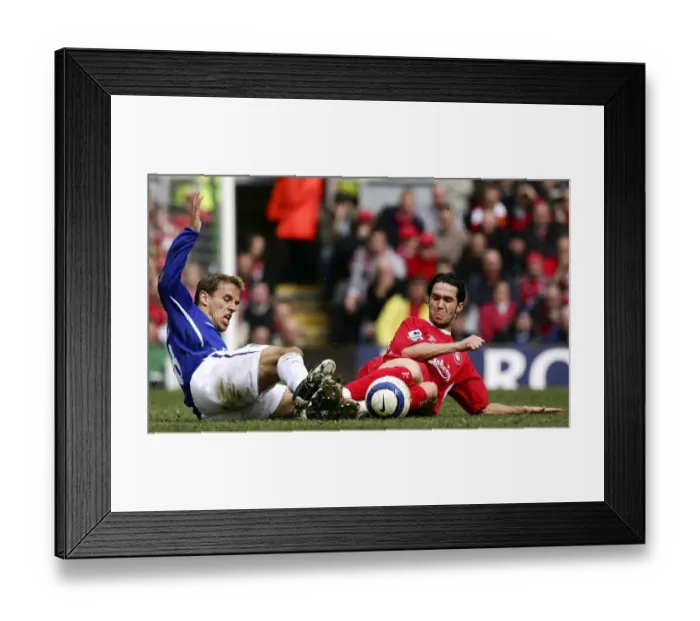 Framed Print : Phil Neville vs Luis Garcia: Intense Tackle on the Football Field Framed Print : Phil Neville vs Luis Garcia: Intense Tackle on the Football Field