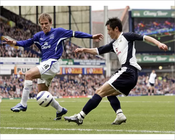 Phil Neville challenges Lee Young-Pyo