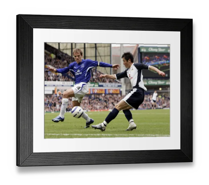 Framed Print : Phil Neville challenges Lee Young-Pyo Framed Print : Phil Neville challenges Lee Young-Pyo