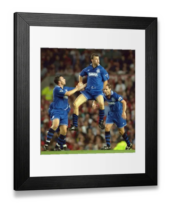 Framed Print : Euphoric Moment: Duncan Ferguson's Iconic Goal vs. Manchester United (1996), FA Premier League Framed Print : Euphoric Moment: Duncan Ferguson's Iconic Goal vs. Manchester United (1996), FA Premier League