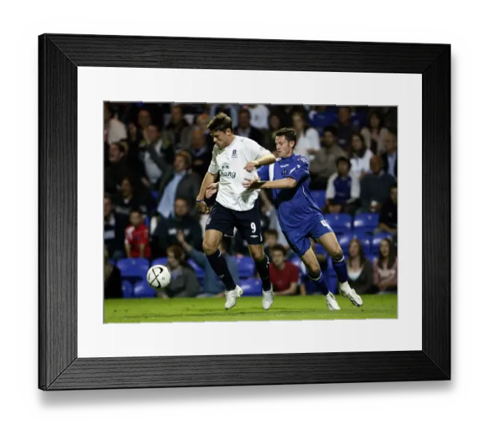 Framed Print : Evertons James Beattie and Peterbroughs Mark Arber in action Framed Print : Evertons James Beattie and Peterbroughs Mark Arber in action