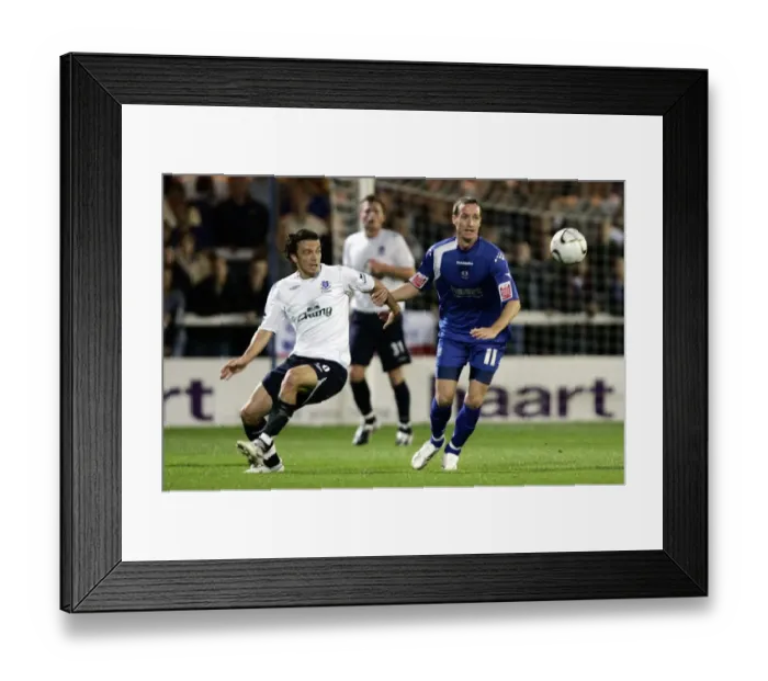 Framed Print : Evertons Simon Davies and Peterbroughs Peter Gain in action