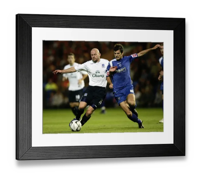 Framed Print : Evertons Lee Carsley and Peterbroughs Richard Butcher in action Framed Print : Evertons Lee Carsley and Peterbroughs Richard Butcher in action