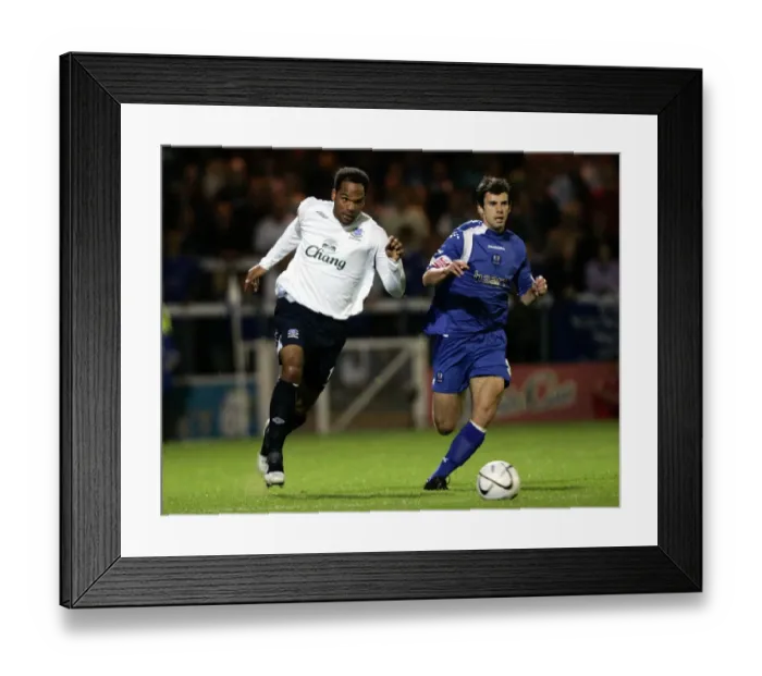 Framed Print : Peterborough United v Everton - Joleon Lescott and Peterboroughs Richard Butcher Framed Print : Peterborough United v Everton - Joleon Lescott and Peterboroughs Richard Butcher