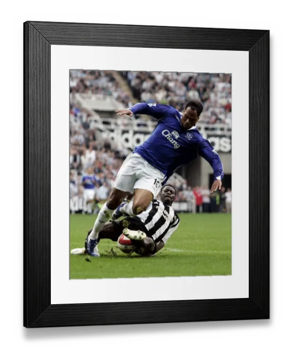 Framed Print : Newcastles Obafemi Martins tackles Evertons Joleon Lescott Framed Print : Newcastles Obafemi Martins tackles Evertons Joleon Lescott