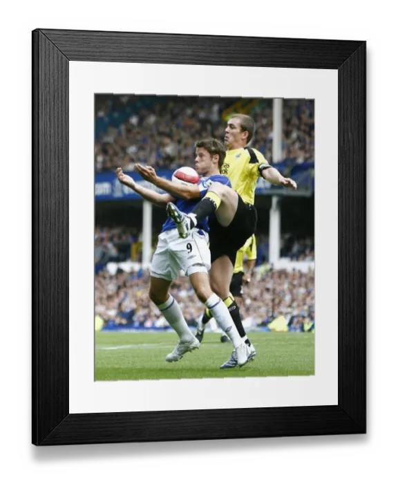 Framed Print : James Beattie in action against Man Citys Richard Dunne Framed Print : James Beattie in action against Man Citys Richard Dunne