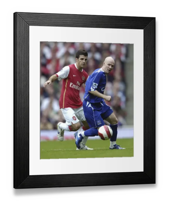 Framed Print : Intense Rivalry: Fabregas vs. Johnson - Arsenal vs. Everton Framed Print : Intense Rivalry: Fabregas vs. Johnson - Arsenal vs. Everton