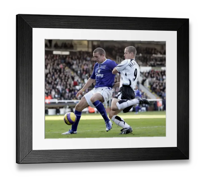 Framed Print : Fulham v Everton - 4  /  11  /  06 Evertons Alan Stubbs and Fulhams Heidar Helguson in action