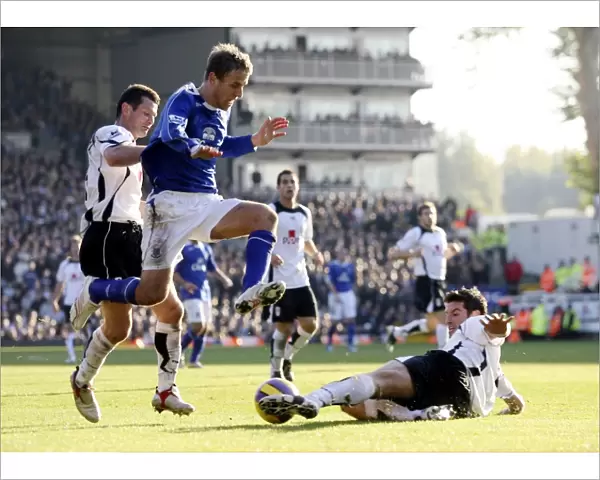 Fulham v Everton - 4  /  11  /  06 Franck Quedrue of Fulham slides in to tackle Evertons Phil Neville