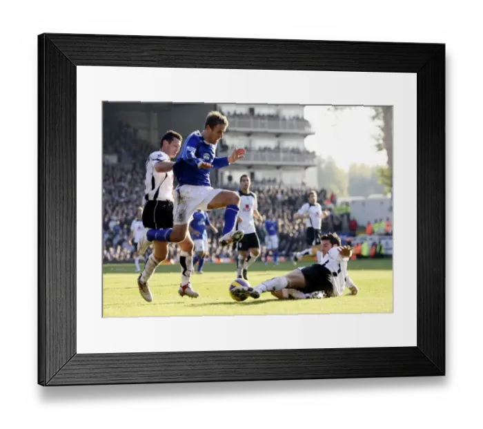 Framed Print : Fulham v Everton - 4  /  11  /  06 Franck Quedrue of Fulham slides in to tackle Evertons Phil Neville