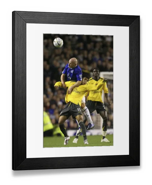 Framed Print : Arsenals Denilson challenges Evertons Carsley for the ball in Liverpool Framed Print : Arsenals Denilson challenges Evertons Carsley for the ball in Liverpool