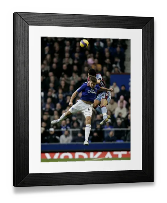 Framed Print : Everton v Aston Villa Evertons James Beattie in action against Aston Villas Liam Ridgewell
