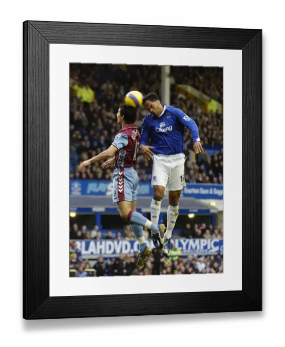 Framed Print : Intense Rivalry: Lescott vs Ridgewell's Battle for Ball Possession - Everton vs Aston Villa (FA Barclays Premiership, Goodison Park, 11 / 11 / 06) Framed Print : Intense Rivalry: Lescott vs Ridgewell's Battle for Ball Possession - Everton vs Aston Villa (FA Barclays Premiership, Goodison Park, 11 / 11 / 06)