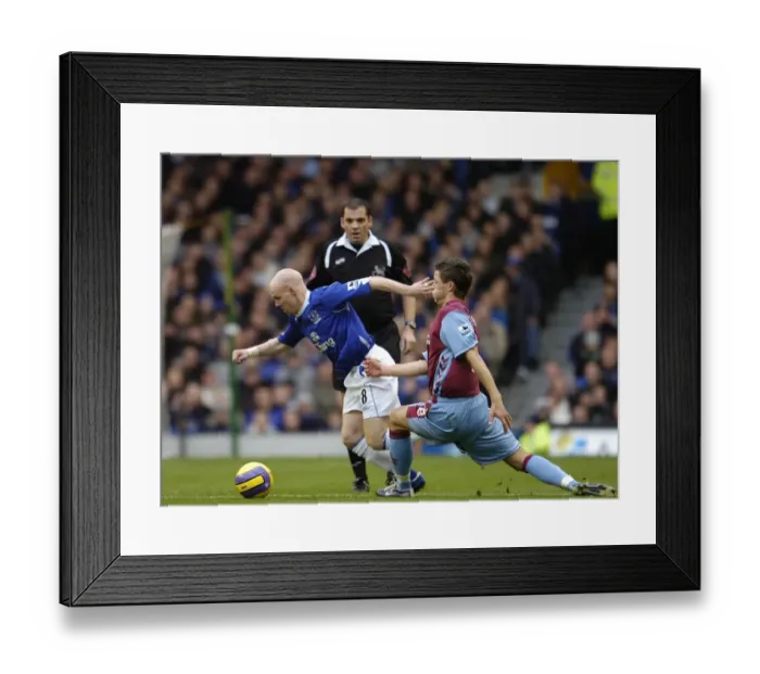 Framed Print : Everton v Aston Villa Andrew Johnson - Everton in action against Gary Cahill