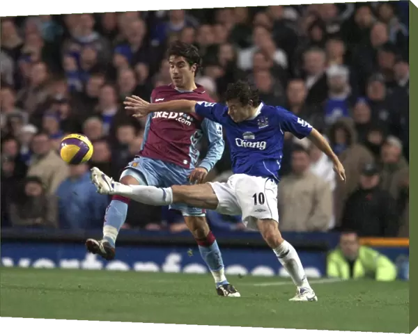 Simon Davies - Everton in action against Juan Pablo Angel - Aston Villa