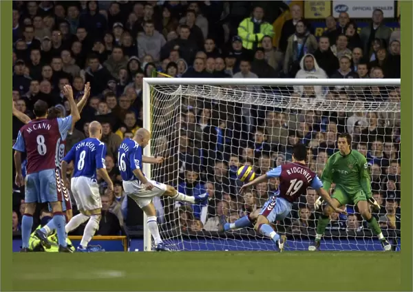 Everton v Aston Villa Lee Carsley - Everton shoots at goal under pressure from Liam Ridgewell