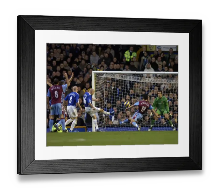 Framed Print : Everton v Aston Villa Lee Carsley - Everton shoots at goal under pressure from Liam Ridgewell Framed Print : Everton v Aston Villa Lee Carsley - Everton shoots at goal under pressure from Liam Ridgewell