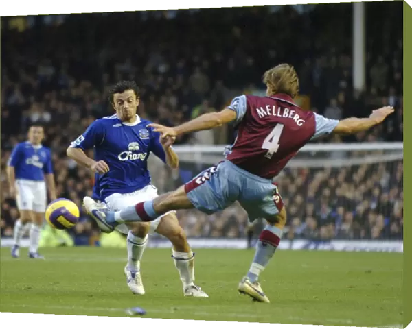 Everton v Aston Villa Simon Davies in action against Olof Mellberg