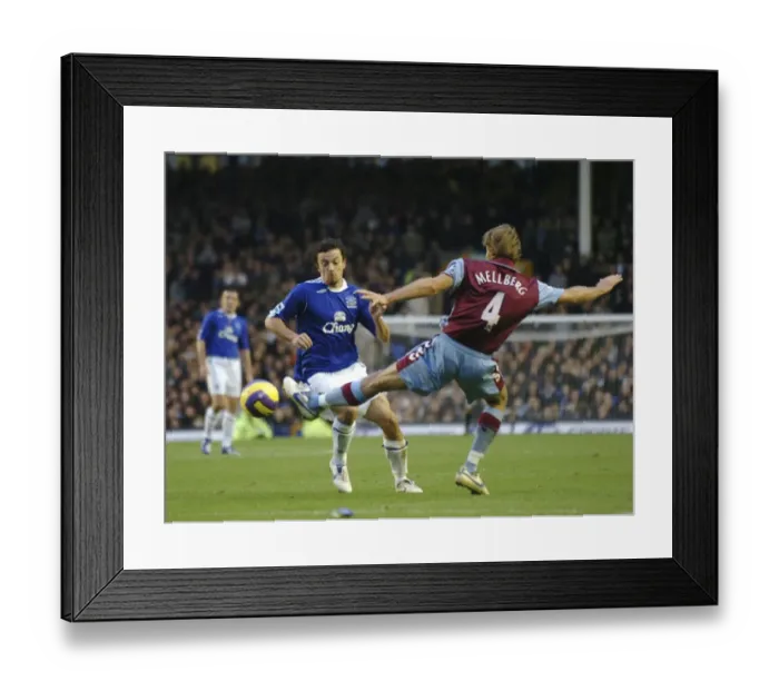 Framed Print : Everton v Aston Villa Simon Davies in action against Olof Mellberg Framed Print : Everton v Aston Villa Simon Davies in action against Olof Mellberg