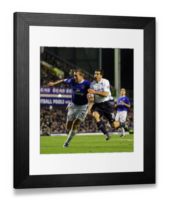 Framed Print : Everton v Bolton Alan Stubbs - Everton and Ben Haim - Bolton Wanderers Framed Print : Everton v Bolton Alan Stubbs - Everton and Ben Haim - Bolton Wanderers