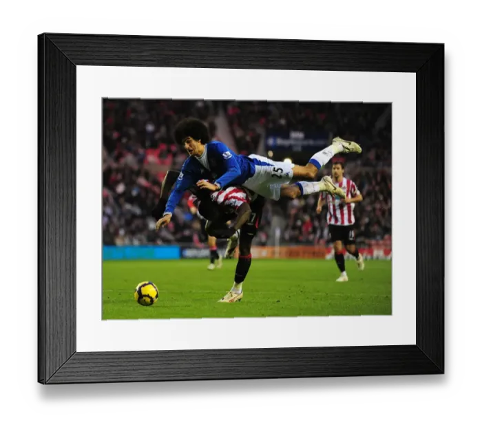 Framed Print : Intense Rivalry: Fellaini vs. Jones - A Battle for Supremacy in the Premier League