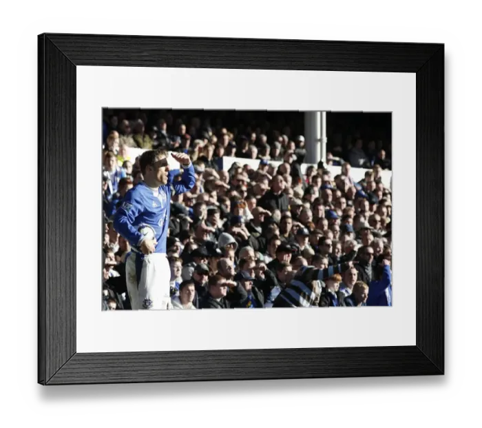 Framed Print : Everton's Phil Neville Shields Sun-Obscured Gaze at Goodison Park during Everton vs West Ham United, Premier League