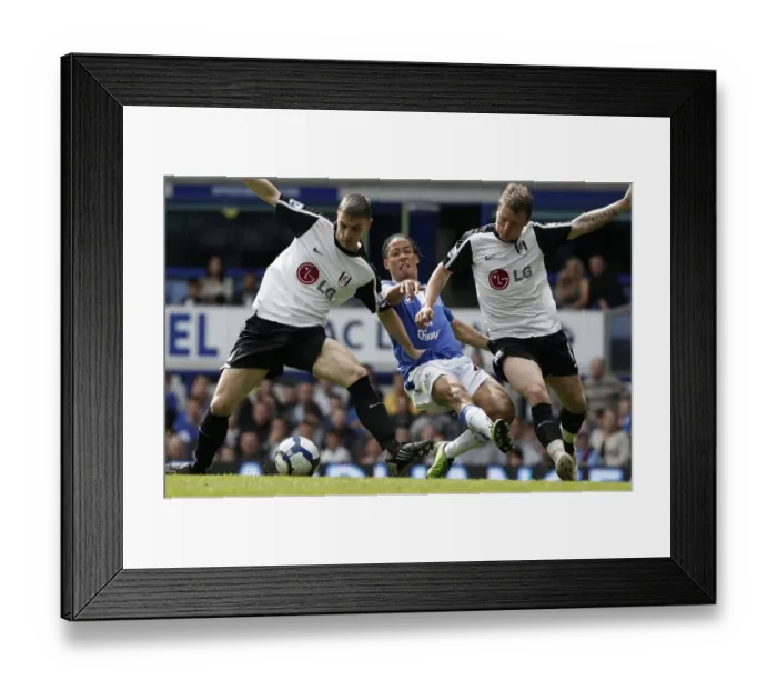 Framed Print : Intense Battle on the Field: Pienaar vs Riise & Baird