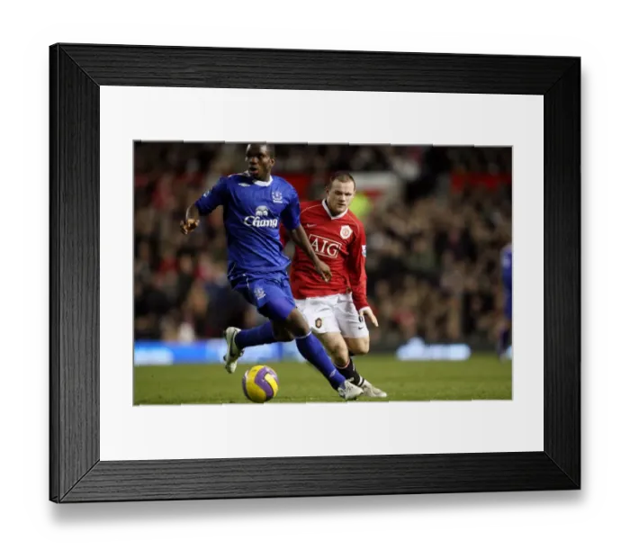 Framed Print : Yobo vs Rooney: Everton vs Manchester United Clash at Old Trafford, 2006 Framed Print : Yobo vs Rooney: Everton vs Manchester United Clash at Old Trafford, 2006
