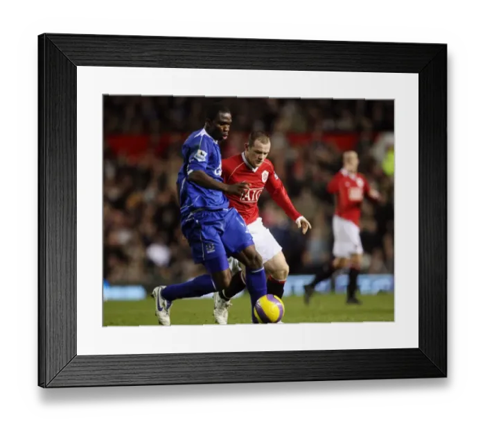 Framed Print : Manchester United v Everton Joseph Yobo Everton in action against Wayne Rooney