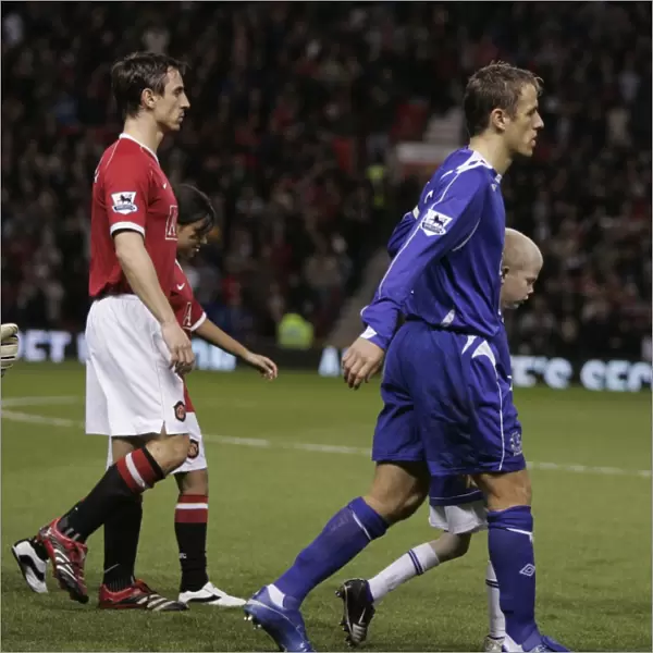 Brothers Neville and Neville lead out Manchester United and Everton