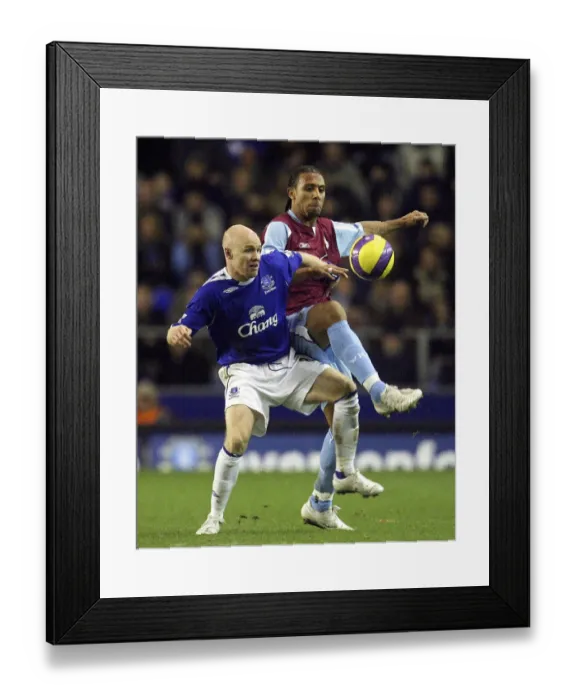 Framed Print : Everton vs. West Ham United: A Clash Between Andy Johnson and Anton Ferdinand Framed Print : Everton vs. West Ham United: A Clash Between Andy Johnson and Anton Ferdinand