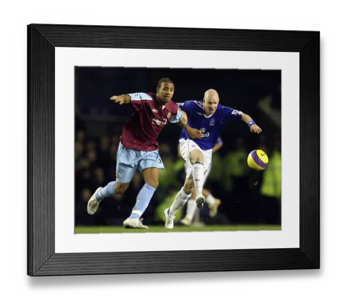 Framed Print : Everton vs. West Ham: A Rivalry Ignited - Johnson vs. Ferdinand Framed Print : Everton vs. West Ham: A Rivalry Ignited - Johnson vs. Ferdinand